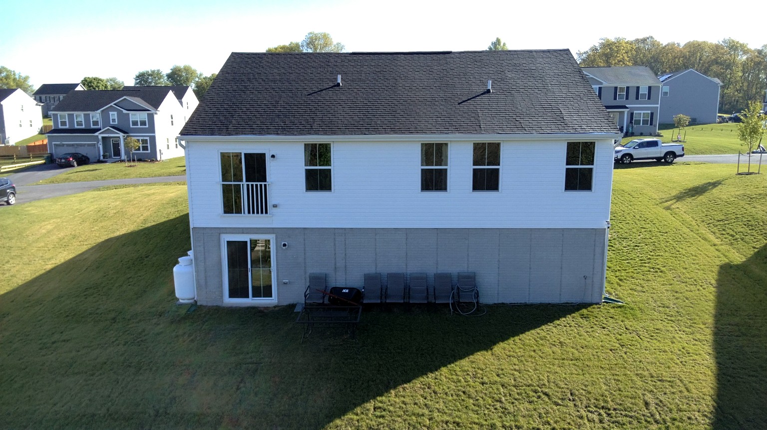 Before: rear of the house without a deck