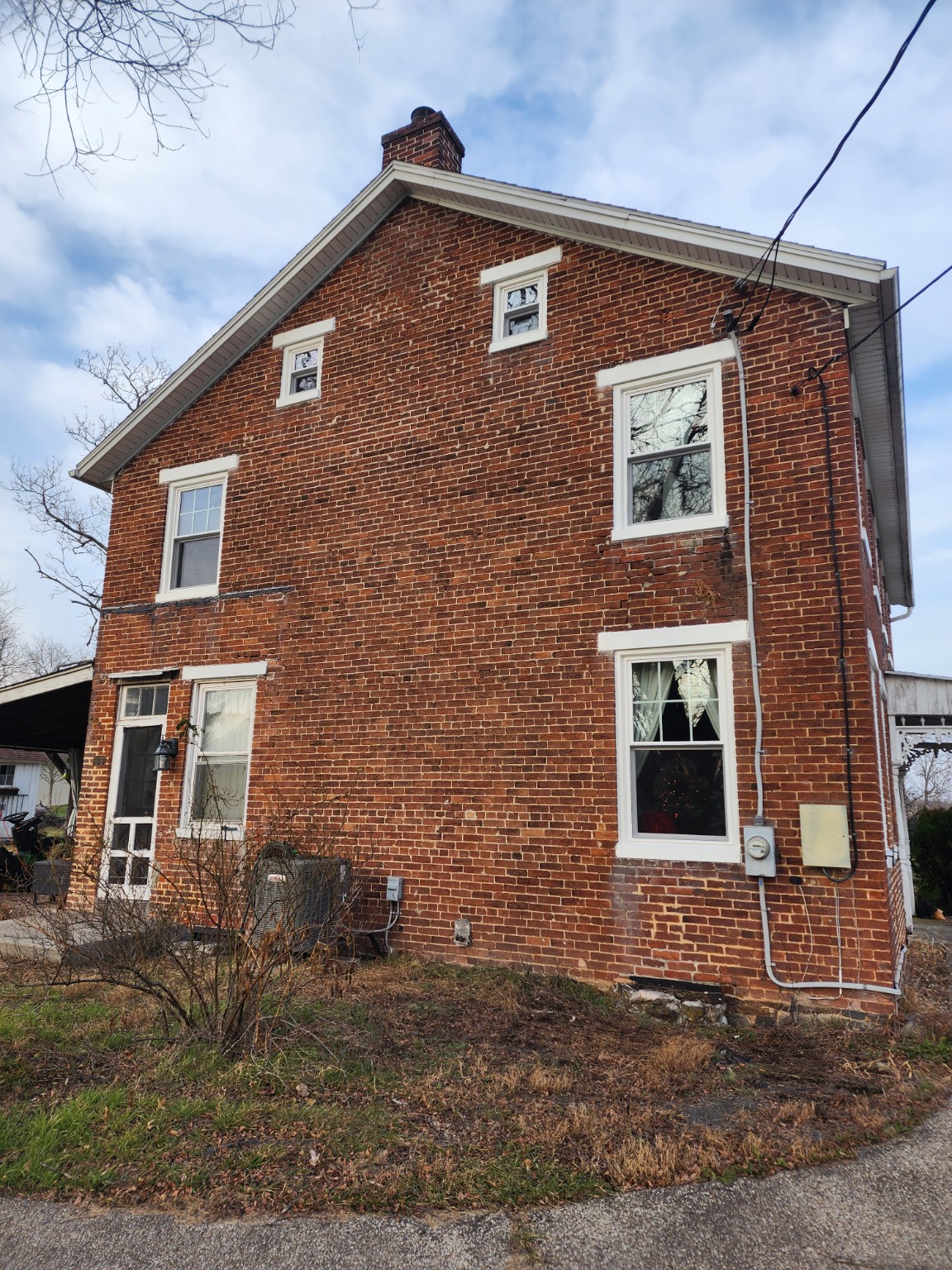 Side view of replacement windows in the historic brick building